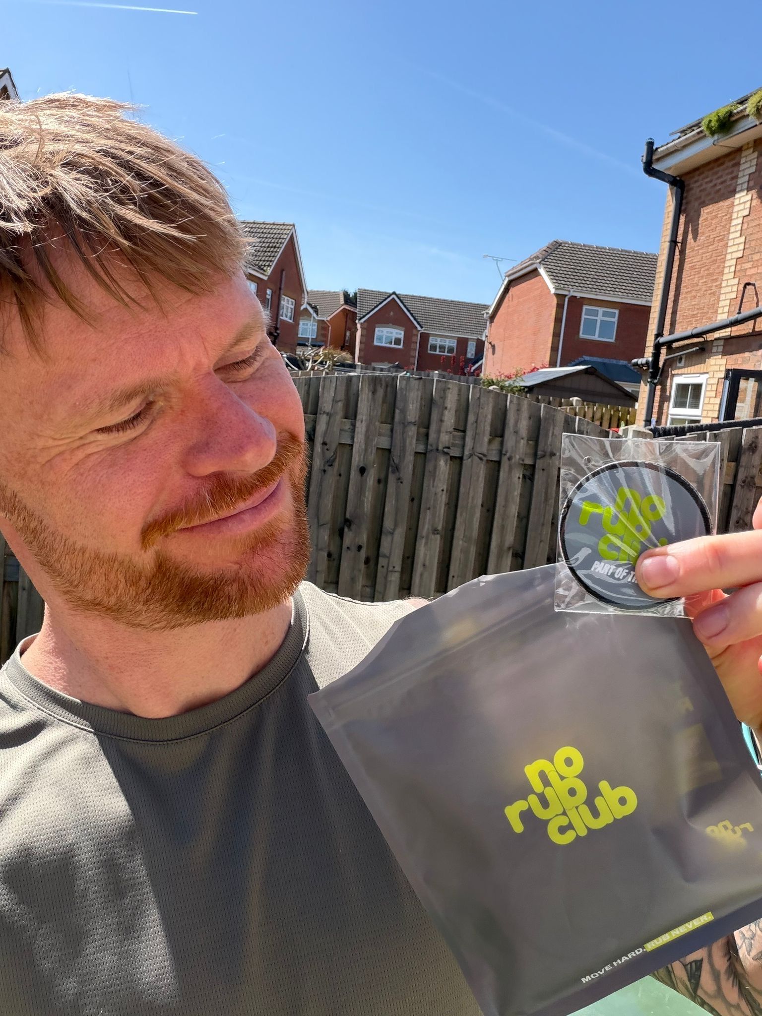 Club member holding a No Rub Club pack