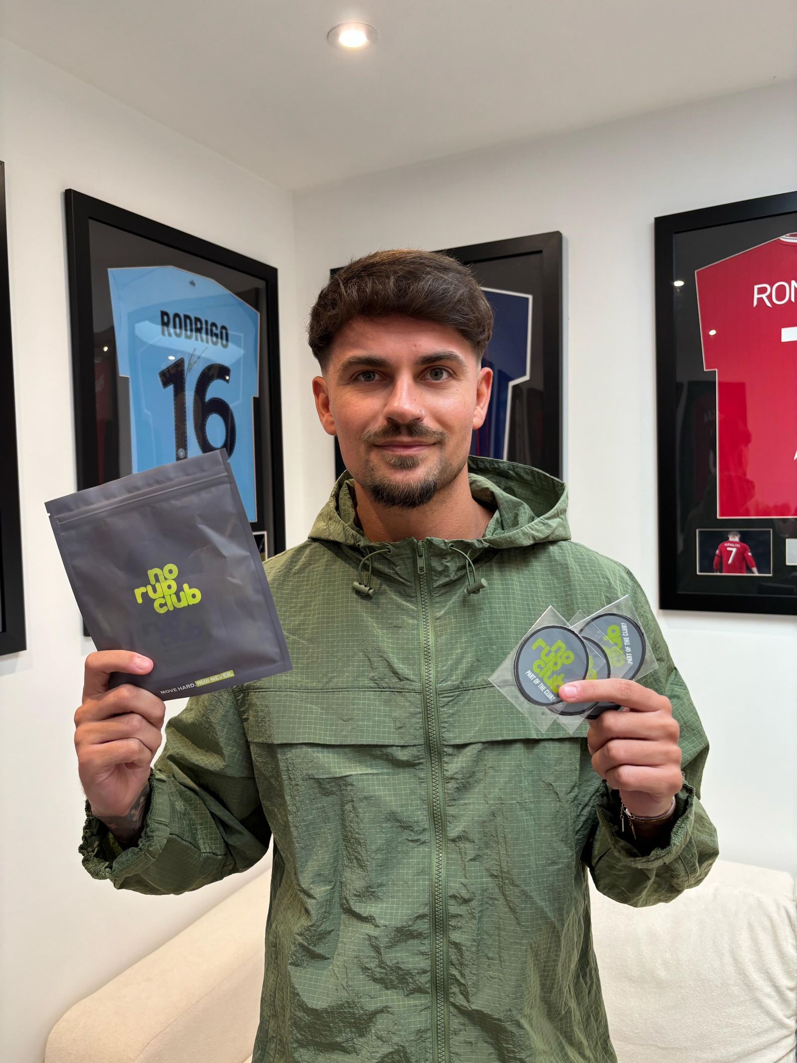 Club member holding a No Rub Club pack and tape
